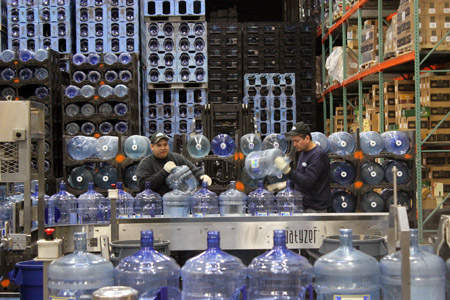 Lots of water bottles in a warehouse